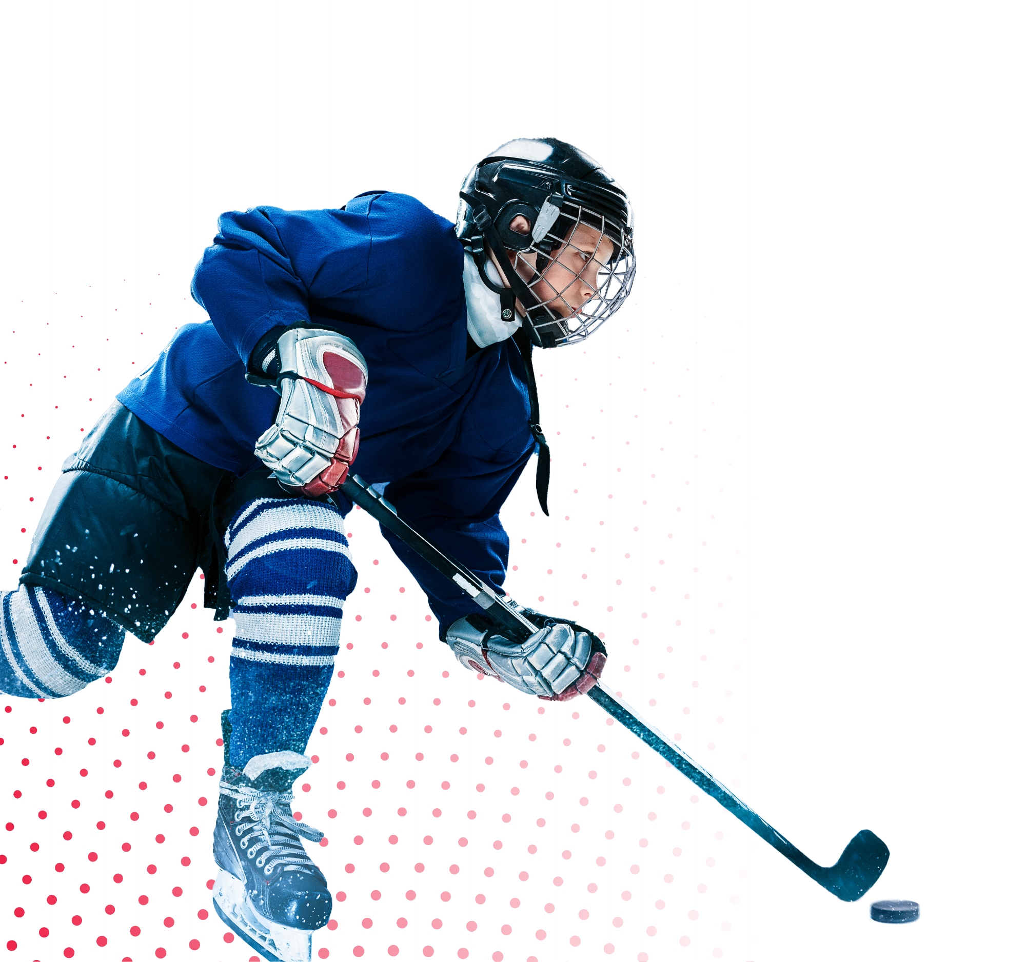 a boy in a hockey uniform hitting a puck