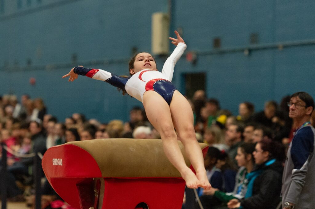 A gymnast attempts a landing